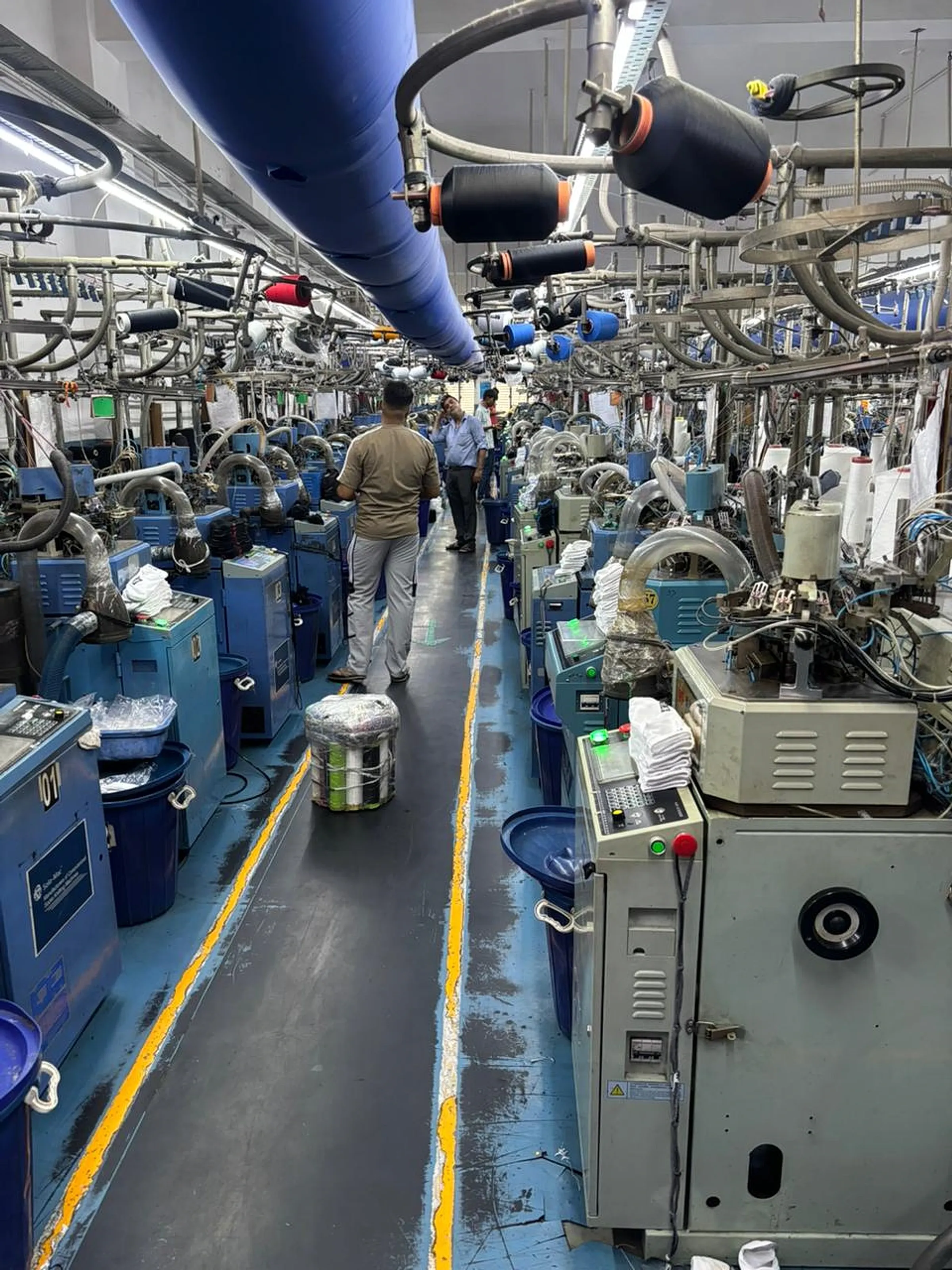 Circular sock knitting machines on the production floor