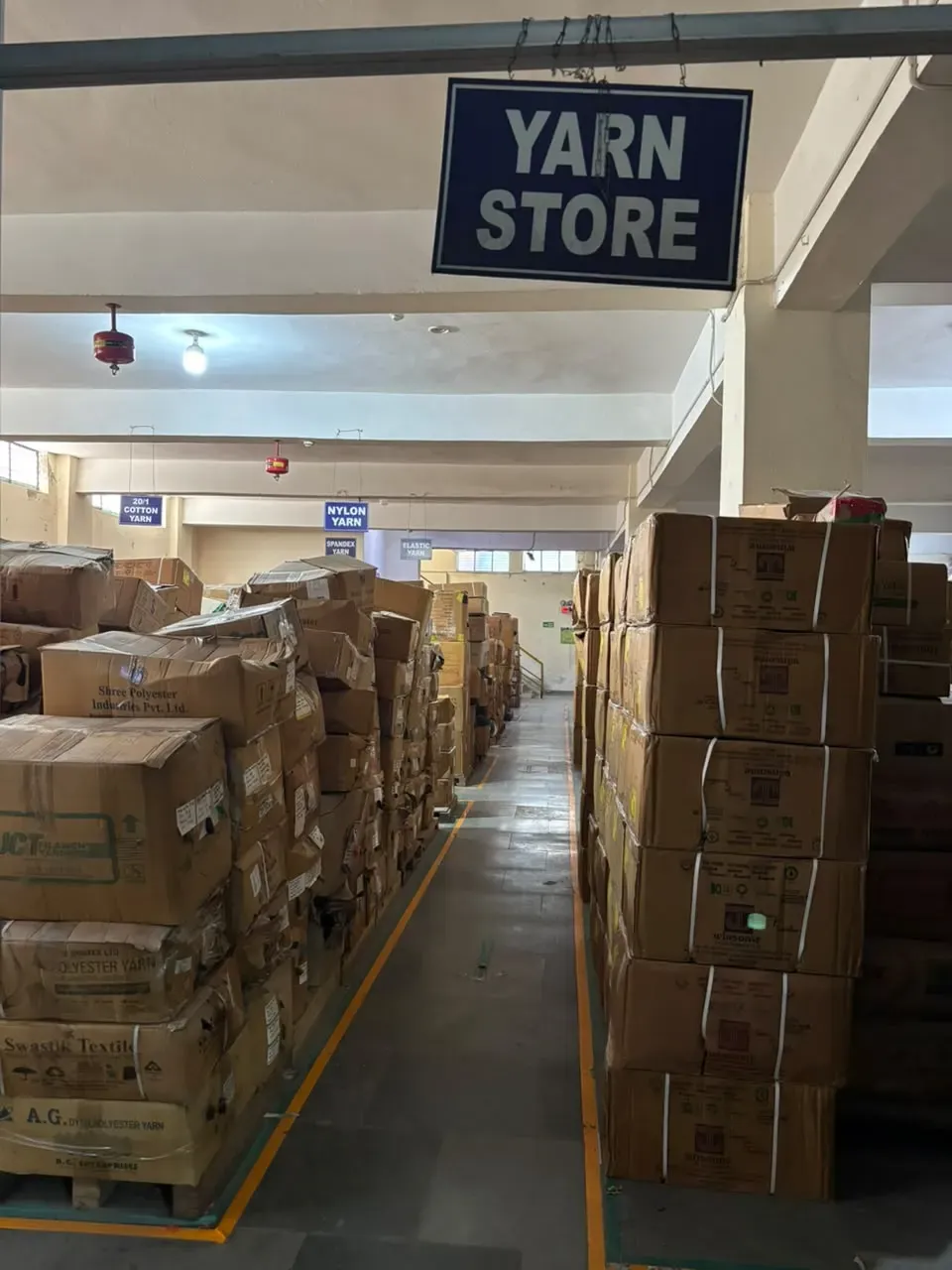 Labelled yarn storage aisles at the factory